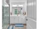 Bright bathroom with walk-in shower and dual sink vanity with neutral colors and cabinets at 820 Madiera Dr. # 14, North Myrtle Beach, SC 29582