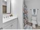 Bathroom with toilet, vanity, and shower with themed shower curtain at 820 Madiera Dr. # 14, North Myrtle Beach, SC 29582
