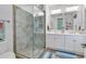 Bathroom with a large walk-in shower and a dual sink vanity with nice mirrors at 820 Madiera Dr. # 14, North Myrtle Beach, SC 29582