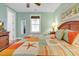 Bright bedroom with a ceiling fan, colorful decor, and a window with blinds at 820 Madiera Dr. # 14, North Myrtle Beach, SC 29582