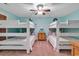 Bedroom with bunk beds, fan, and coastal style decor providing a comfortable space at 820 Madiera Dr. # 14, North Myrtle Beach, SC 29582