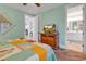 Spacious bedroom with attached bathroom, ceiling fan, and stylish decor at 820 Madiera Dr. # 14, North Myrtle Beach, SC 29582
