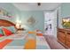 Cozy bedroom features stylish bedding, nautical art, and warm lighting at 820 Madiera Dr. # 14, North Myrtle Beach, SC 29582