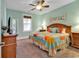 Comfortable bedroom with a ceiling fan, a window with blind and stylish decor at 820 Madiera Dr. # 14, North Myrtle Beach, SC 29582
