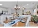 Open concept dining area featuring a chandelier, ceiling fan, and seating for six at 820 Madiera Dr. # 14, North Myrtle Beach, SC 29582