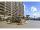 Beautiful water fountain with lush greenery between two high-rise buildings at 820 Madiera Dr. # 14, North Myrtle Beach, SC 29582
