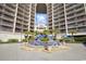 Beautiful water fountain with palm trees between two high-rise buildings at 820 Madiera Dr. # 14, North Myrtle Beach, SC 29582