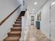 Hallway with staircase, tile floor, blue dresser, and a nice view of the home's interior at 820 Madiera Dr. # 14, North Myrtle Beach, SC 29582
