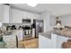 Modern kitchen featuring white cabinets, stainless steel appliances, and granite countertops at 820 Madiera Dr. # 14, North Myrtle Beach, SC 29582
