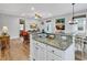 Open kitchen with bar seating, stainless steel appliances, granite countertops and hardwood floors at 820 Madiera Dr. # 14, North Myrtle Beach, SC 29582