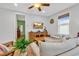 Relaxing living area with a ceiling fan, television, and plush seating arrangement at 820 Madiera Dr. # 14, North Myrtle Beach, SC 29582