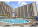 Large outdoor pool surrounded by high-rise buildings, offering luxury amenities at 820 Madiera Dr. # 14, North Myrtle Beach, SC 29582