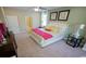 Bright bedroom featuring a plush bed with decorative pillows and ceiling fan at 860 Ireland Dr., Longs, SC 29568