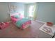 Cozy bedroom decorated with colorful bedding, curtains, and artwork at 860 Ireland Dr., Longs, SC 29568