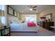 Serene bedroom with plush carpet, a ceiling fan, and an adjacent sitting area for relaxing or working at 860 Ireland Dr., Longs, SC 29568