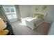 Well-lit bedroom with a white bed, neutral bedding, and decorative window curtains at 860 Ireland Dr., Longs, SC 29568
