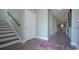 Inviting home entryway and staircase, featuring hardwood floors and neutral paint at 860 Ireland Dr., Longs, SC 29568