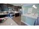 Modern kitchen with stainless steel appliances, spacious granite counters, and dark wood cabinets at 860 Ireland Dr., Longs, SC 29568
