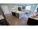 Open-concept kitchen with an island, stainless steel appliances, and view into living area at 860 Ireland Dr., Longs, SC 29568
