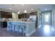 Modern kitchen island with seating, stainless steel appliances, and ample counter space at 860 Ireland Dr., Longs, SC 29568