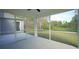 Screened-in patio with a view of the backyard and surrounding trees at 860 Ireland Dr., Longs, SC 29568