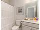 Clean bathroom featuring a shower with a decorative curtain, a toilet, and vanity with sink at 867 Ireland Dr., Longs, SC 29568
