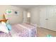 Comfortable bedroom featuring a double door closet, artwork and colorful bedding at 867 Ireland Dr., Longs, SC 29568