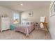 Bright bedroom featuring a metal bed frame, soft carpet, and natural light from the window at 867 Ireland Dr., Longs, SC 29568