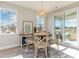 Charming dining area with modern lighting and sliding glass doors leading to the outdoor space at 867 Ireland Dr., Longs, SC 29568