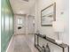 Welcoming entryway featuring stylish wall paneling, light wood floors, and modern decor at 867 Ireland Dr., Longs, SC 29568