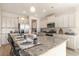 Spacious kitchen island featuring granite countertops, stainless steel appliances, and ample cabinet space at 867 Ireland Dr., Longs, SC 29568