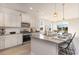 Bright kitchen with stainless appliances, granite countertops, and a view to the dining area at 867 Ireland Dr., Longs, SC 29568