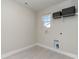 Simple laundry room with tile flooring, utility connections, and a window for natural light at 867 Ireland Dr., Longs, SC 29568