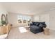 Inviting living room featuring a comfortable couch, windows and stylish furniture at 867 Ireland Dr., Longs, SC 29568