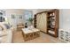Comfortable living area showcasing barn door shelving and a stylish coffee table on a woven rug at 867 Ireland Dr., Longs, SC 29568
