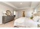 Bright and airy main bedroom featuring a decorative mirror, and soft neutral tones at 867 Ireland Dr., Longs, SC 29568