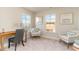 Cozy sitting room featuring two comfortable chairs, a desk, and bright natural light at 867 Ireland Dr., Longs, SC 29568