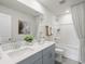 Modern bathroom featuring double sinks, gray cabinetry, and a shower-tub combination at 871 Cypress Preserve Circle, Longs, SC 29568