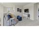 Cozy living room area with comfortable seating, a large TV, and modern decor at 871 Cypress Preserve Circle, Longs, SC 29568