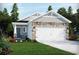 Charming single-Gathering home with stone accents, a two-car garage, and well-maintained landscaping at 875 Cypress Preserve Circle, Longs, SC 29568