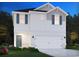 Charming two-story home boasting symmetrical design elements and a well-manicured lawn at 879 Cypress Preserve Circle, Longs, SC 29568
