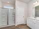 Bathroom features a glass shower enclosure, a modern vanity with ample space and lighting at 885 Ireland Dr., Longs, SC 29568
