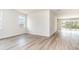 Bright bedroom with wood-look floors and well-lit by windows at 885 Ireland Dr., Longs, SC 29568