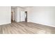 A spacious room features modern flooring, a closet and multiple doors at 885 Ireland Dr., Longs, SC 29568