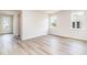 Bright bedroom with wood-look floors and large windows at 885 Ireland Dr., Longs, SC 29568