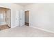 A spacious bedroom with plush carpeting and two doorways to a bathroom and closet at 885 Ireland Dr., Longs, SC 29568