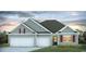 Charming single-Gathering home featuring a two-car garage and landscaped front yard at 885 Ireland Dr., Longs, SC 29568