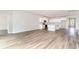 Open-concept living space showcasing a modern kitchen with white cabinets at 885 Ireland Dr., Longs, SC 29568