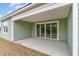 Covered patio offers an outdoor area through sliding glass doors, perfect for entertaining or relaxing at 885 Ireland Dr., Longs, SC 29568