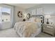 Bright bedroom features stylish decor, comfortable bedding, and natural light from the window at 886 Cypress Preserve Circle, Longs, SC 29568